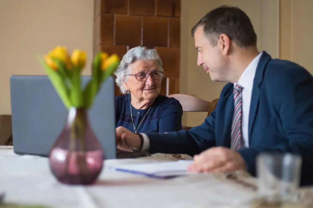Woman and man consulting with help of a computer