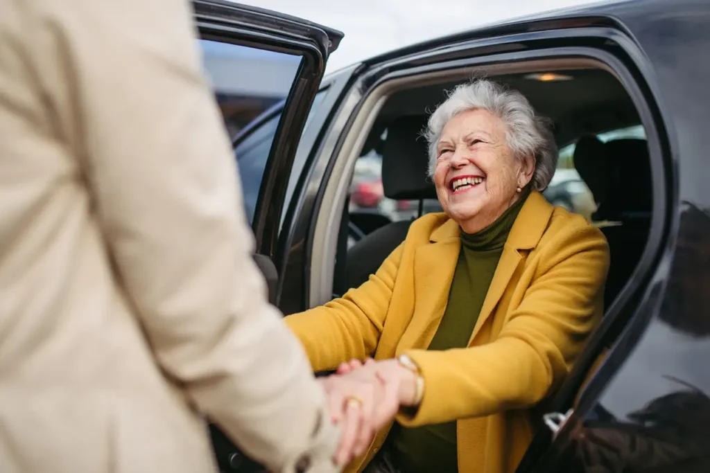 Woman getting out of a car